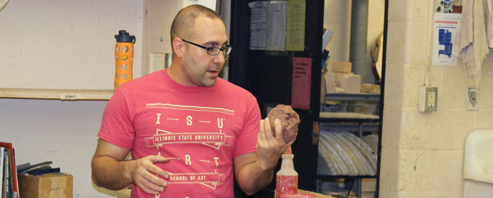 Student works with clay.