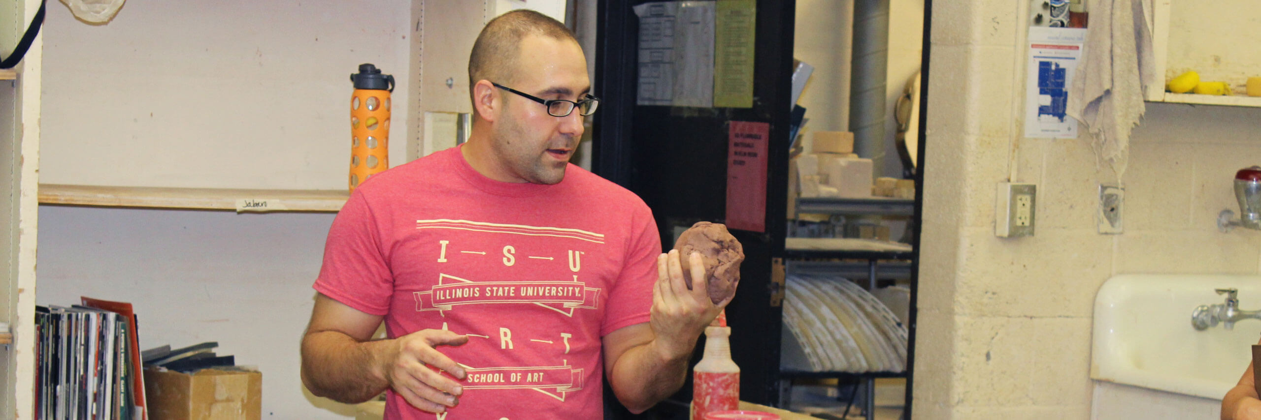 Student works with clay.