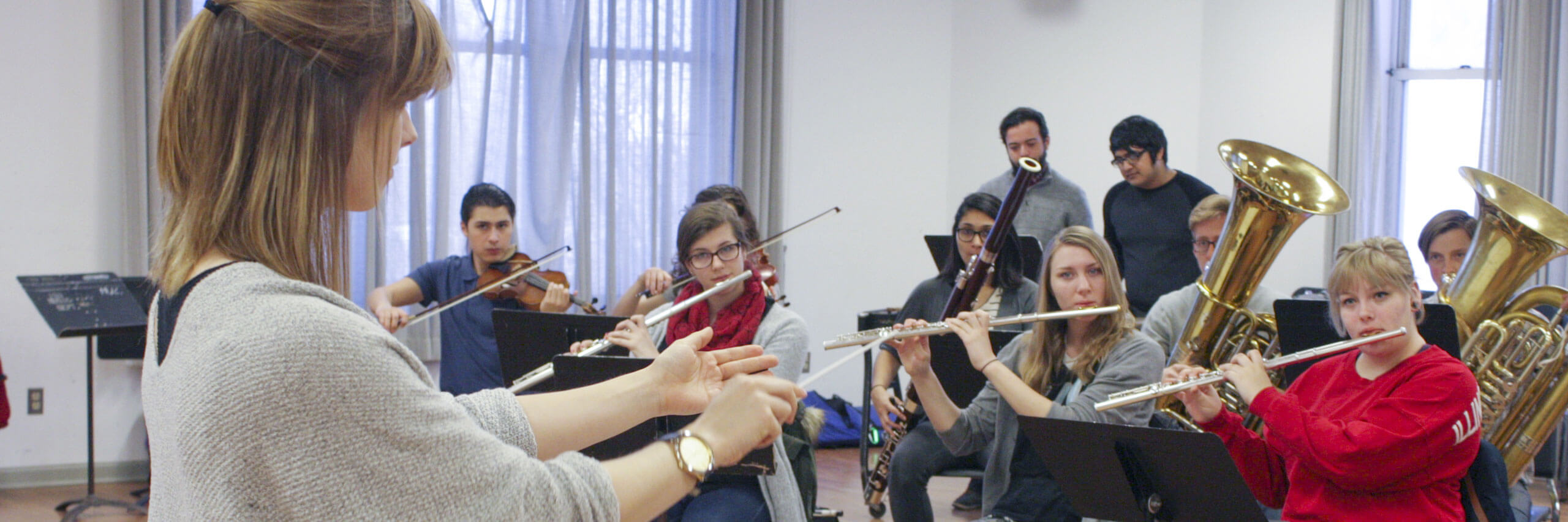 A director conducts their band.