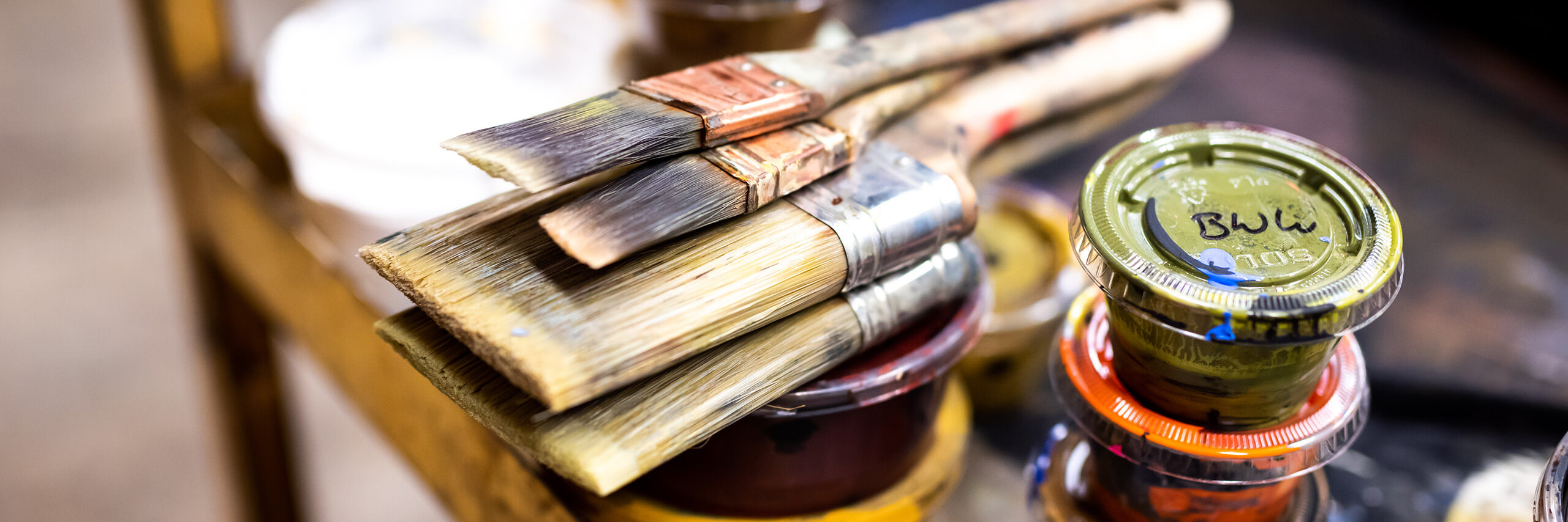 Paintbrushes and paints.