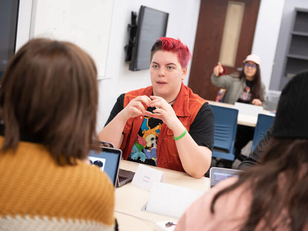 Students work together in a graphic design class.