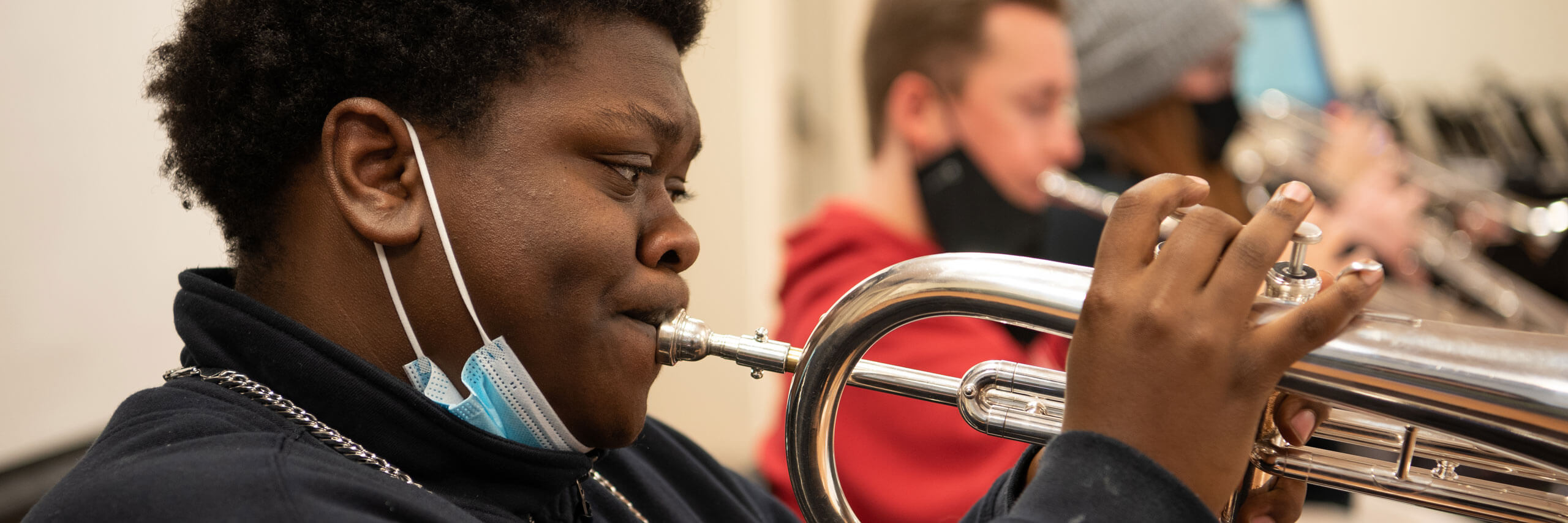 Student plays his trumpet in a jazz ensemble.
