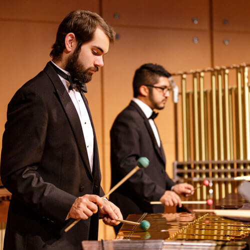 The percussion section plays during a Symphonic Band concert.