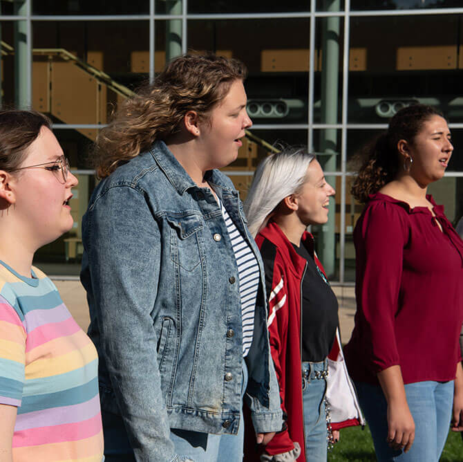 Belle Voix sings out on the quad.