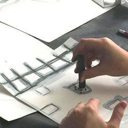 Student draws with pastels.