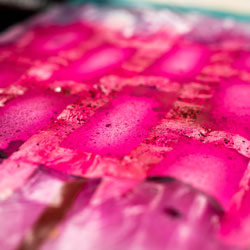 A glittery pink backdrop in progress.