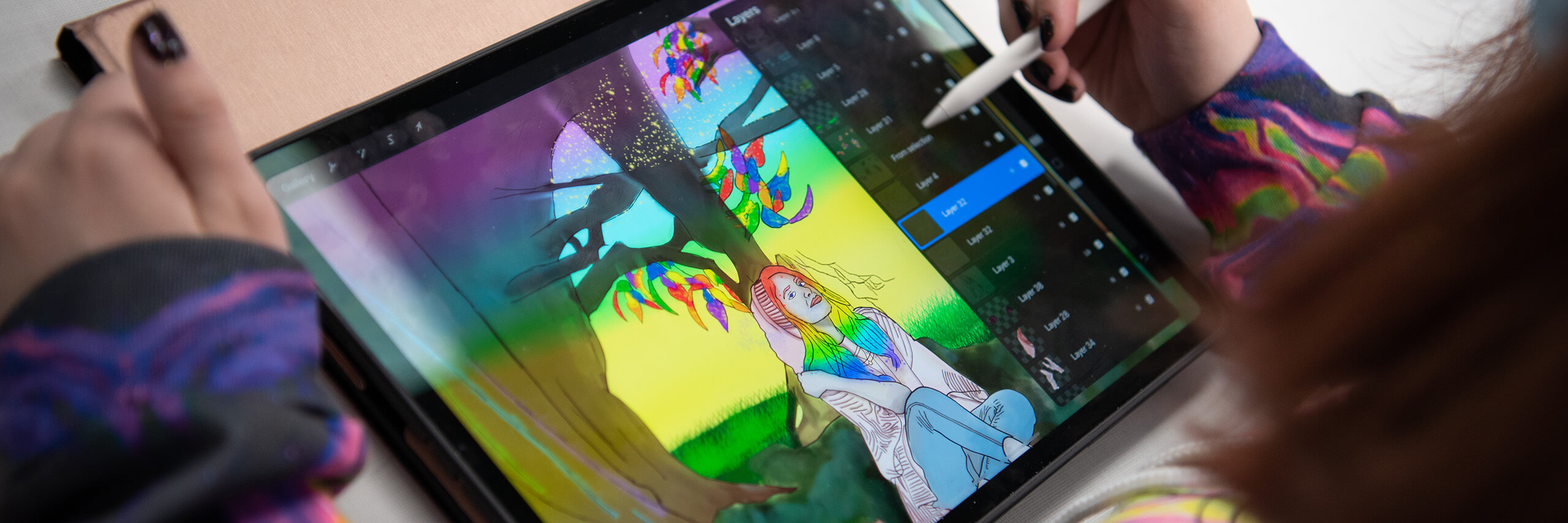 Student creates a digital painting on their iPad.
