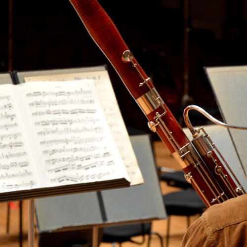 Students plays his bassoon.