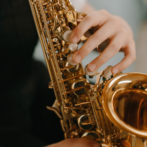 Student plays his saxophone.