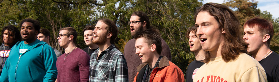 The Men's Glee club performs on the quad.