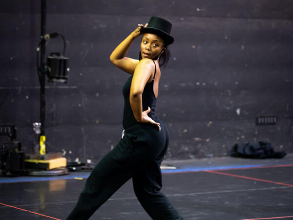 A jazz dancer strikes a pose.